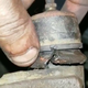 Torn boot on the tie rod end.